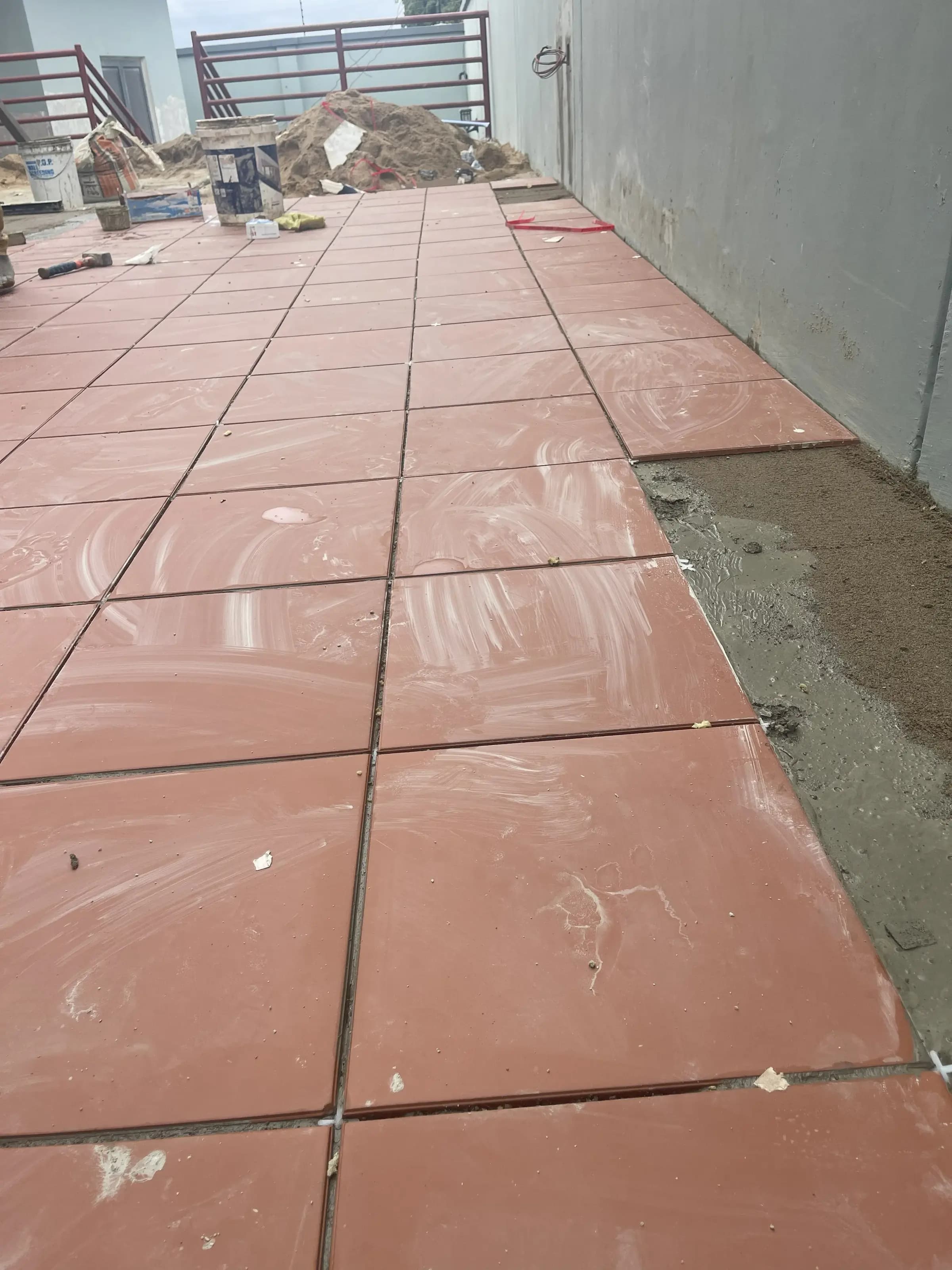 Exterior tiling in progress on the Abeokuta residence terrace