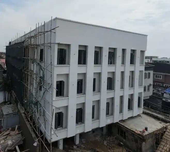 Aerial view of the Stanford Building under scaffold during construction