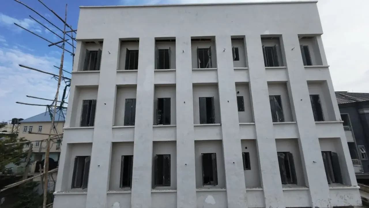 Front elevation of the Stanford Building's rendered facade with recessed window bays